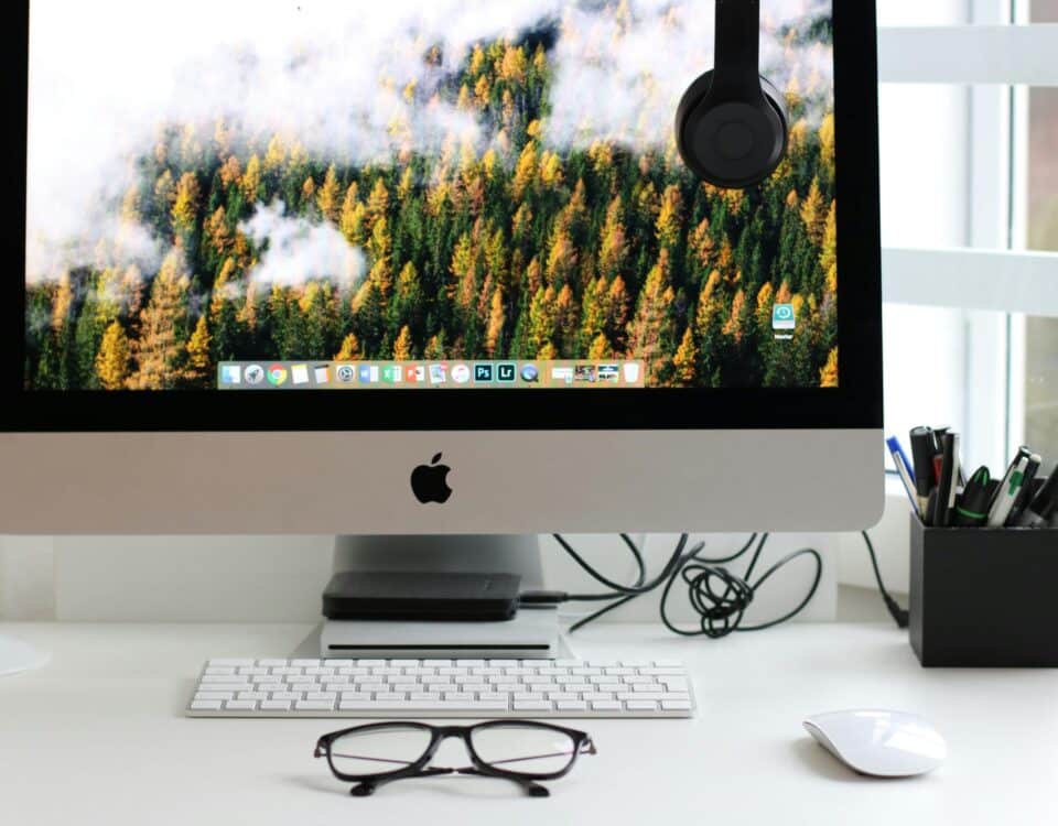 Free Stylish home office workspace featuring a computer setup with accessories. Stock Photo
