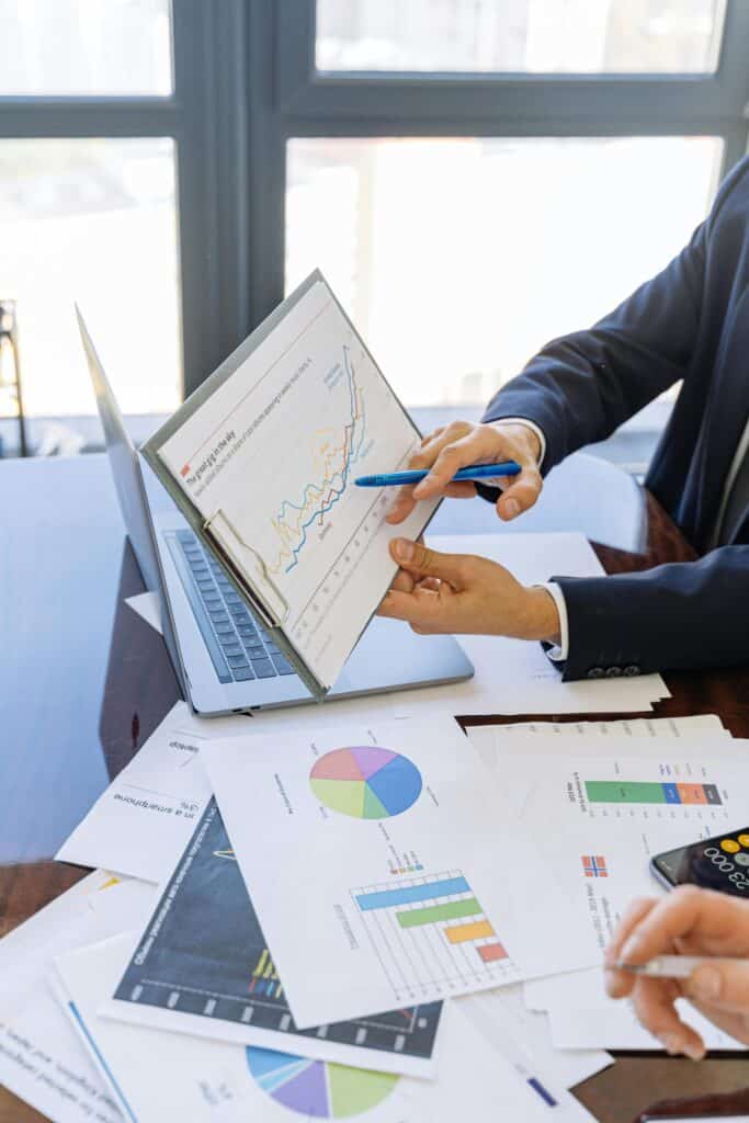 Data-Quality-is-Your-Small-Businesss-Secret-Weapon-scaled.jpg » Flux Labs - Managed Information Technology Services Free Business professionals discussing financial graphs and charts in an office setting. Stock Photo