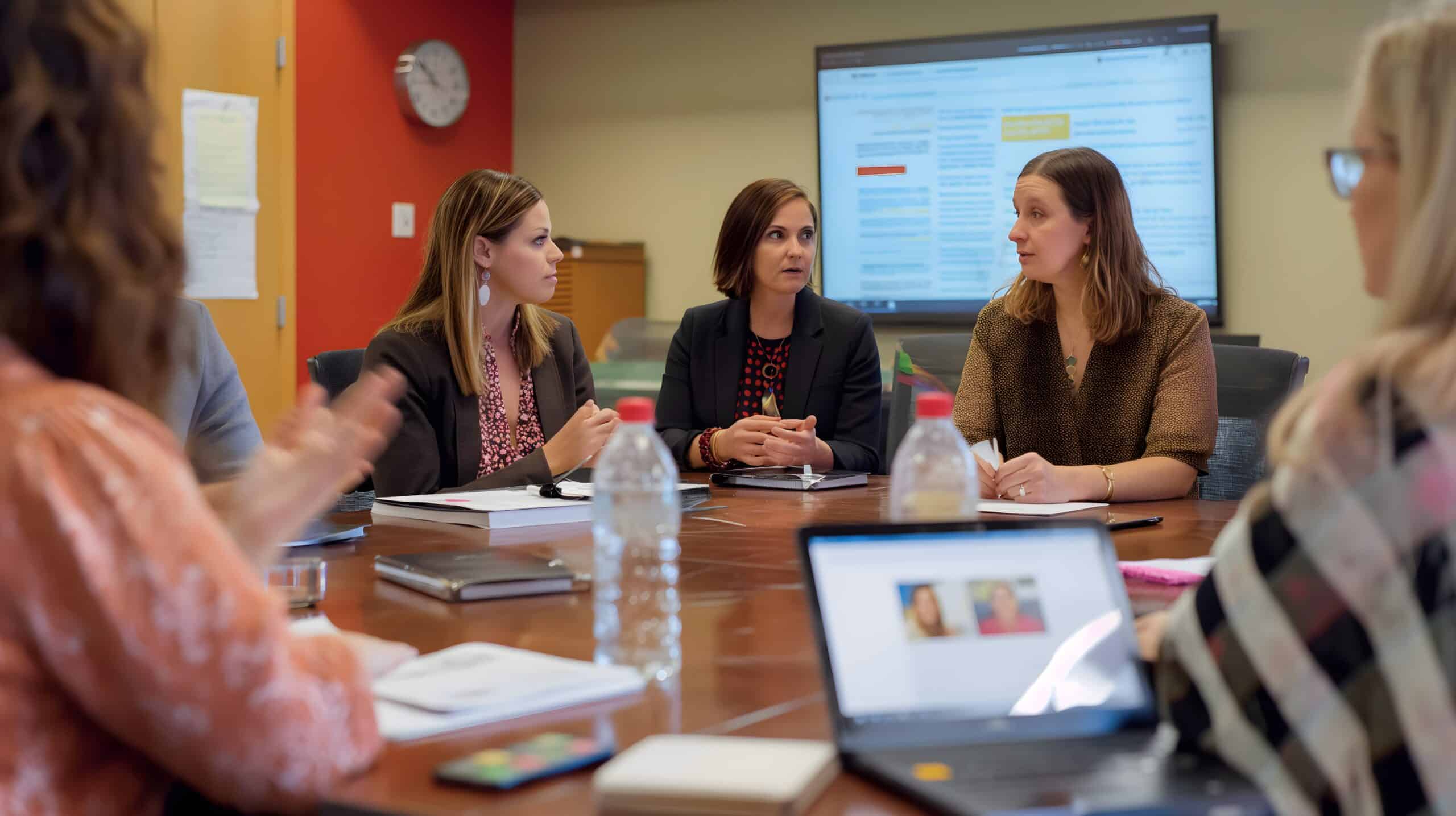 A nonprofit manager leading a meeting with staff with a focus on collaboration and leadership » Flux Labs - Managed Information Technology Services