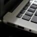 Free Detailed view of a silver laptop showing keyboard and multiple ports. Stock Photo