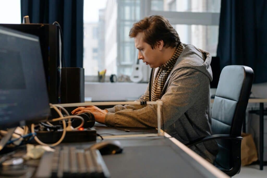 pexels-cottonbro-6803531-scaledjpg » Flux Labs - Managed Information Technology Services Free A concentrated professional working at a computer in a modern office setting. Stock Photo
