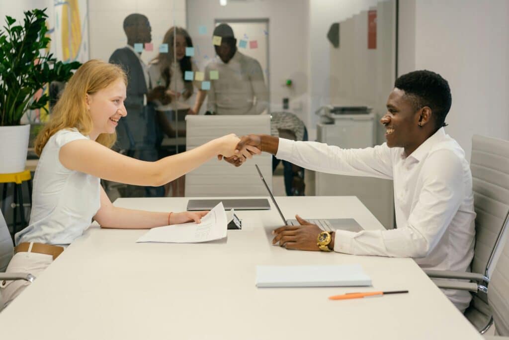 pexels-mikhail-nilov-9301879-scaledjpg » Flux Labs - Managed Information Technology Services Free Business professionals completing a successful deal with a handshake in a modern office setting. Stock Photo
