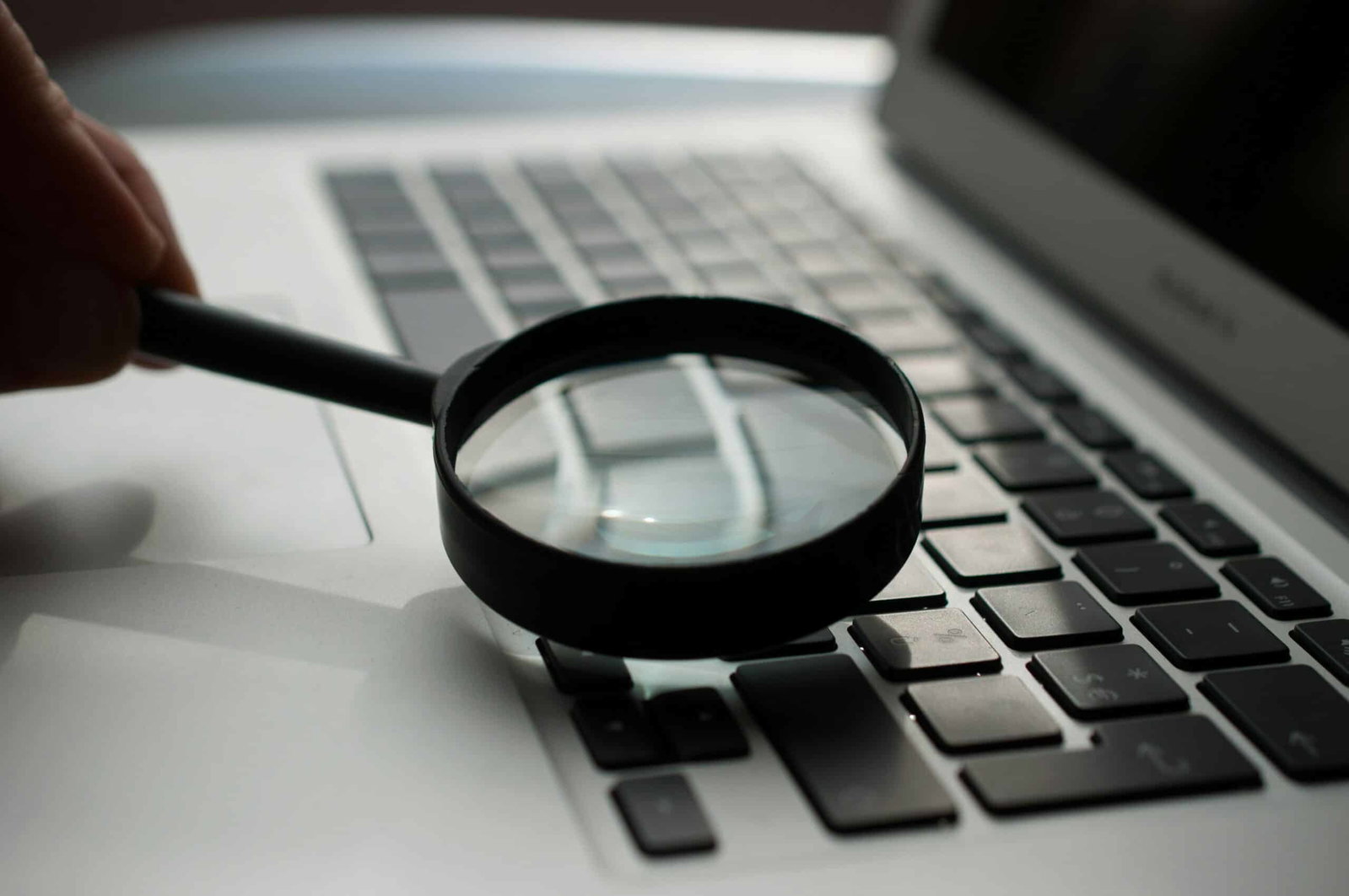 agence-olloweb-d9ILr-dbEdg-unsplashjpg | Flux Labs magnifying glass near gray laptop computer